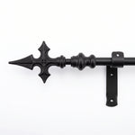 Black wrought iron curtain pole with Church Cross finial