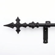 Black wrought iron curtain pole with Church Cross finial