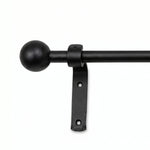 Black wrought iron curtain pole with easy-fit curtain rings and secure brackets