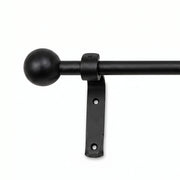 Black wrought iron curtain pole with easy-fit curtain rings and secure brackets