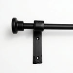 Remove curtain rings from wrought iron curtain pole