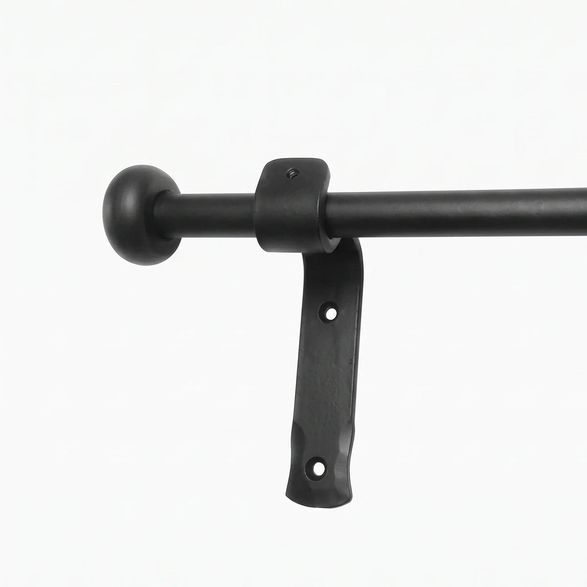 Wrought iron curtain rings being removed from a curtain pole